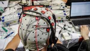 A gamer engaging with a sophisticated brain-computer interface, showcasing the innovative use of BCIs in providing immersive and intuitive gaming experiences.