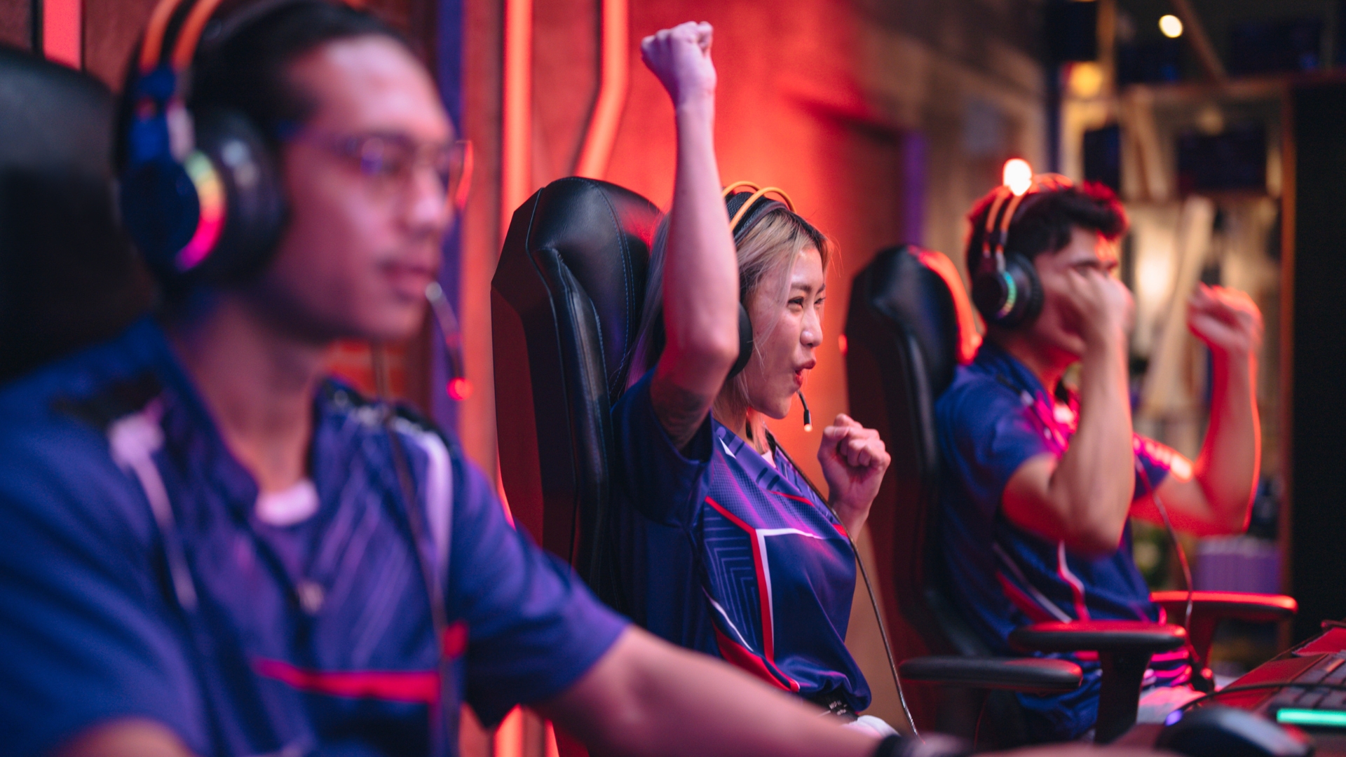 Competitive gamers engrossed in a mobile esports tournament, highlighting the excitement and growth of this emerging sector in the esports industry.